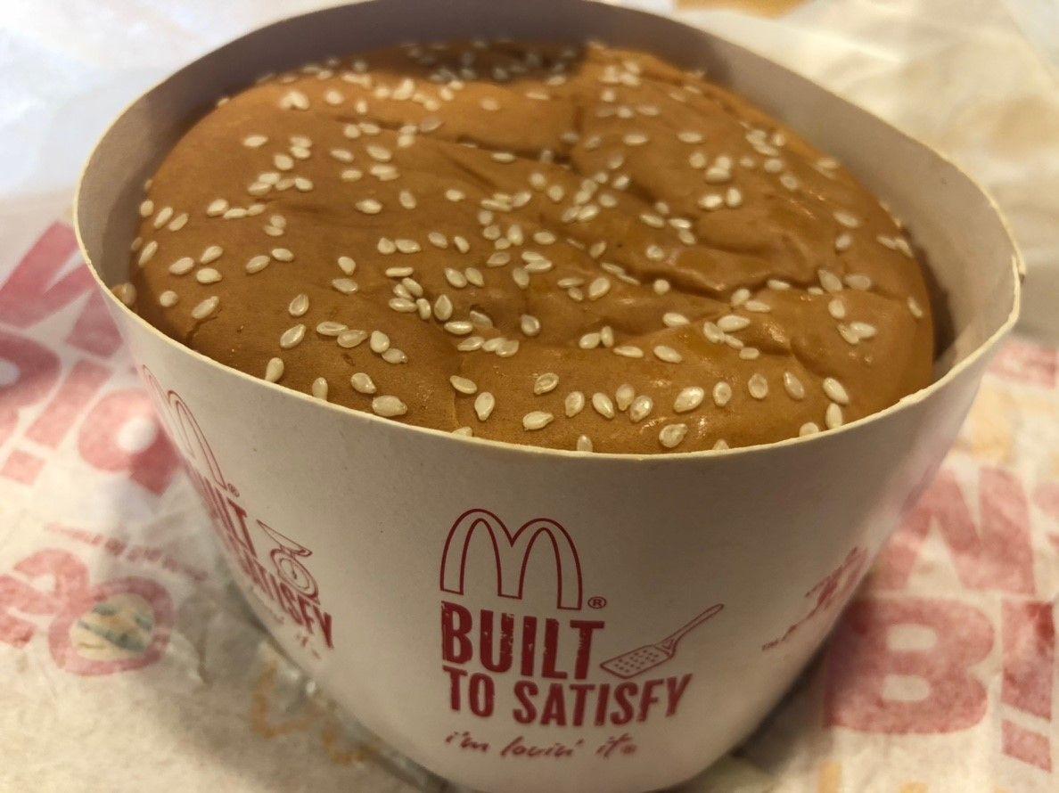 Close-up of a BIG MAC BLT burger wrapped in branded paper at McDonald's Korea.